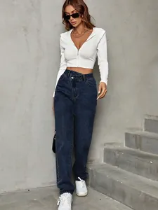 High-waisted loose denim jeans featuring a unique asymmetric crossover waist design.