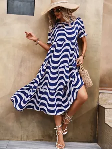 Stylish blue and white wave print midi dress with puff sleeves for summer vacation wear.