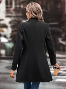 Back view of elegant black mid-length wool coat for women in autumn and winter season