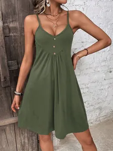 Chic olive green spaghetti strap sundress featuring a V-neckline and decorative buttons