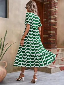 Green and white wavy print maxi dress with puff sleeves and tiered skirt back view detail
