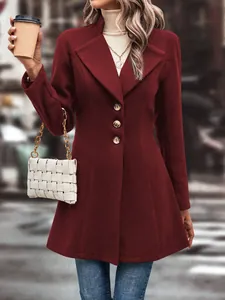 Detail shot of a burgundy wool-like overcoat with notched lapels and three buttons