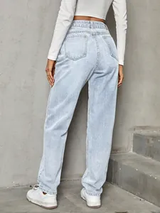 Back view of women's stylish high waisted loose denim jeans in a light blue wash