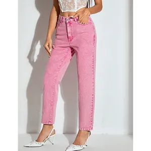 Side view detail of stylish high-waisted pink straight-leg denim jeans
