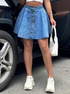 High-waist blue denim A-line mini skirt featuring front button closure and washed finish