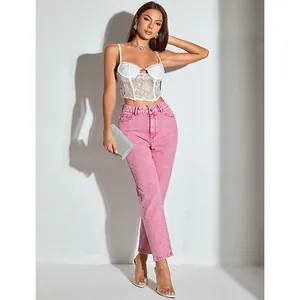 Fashion model showcasing high-waisted straight-leg pink denim jeans with lace camisole top