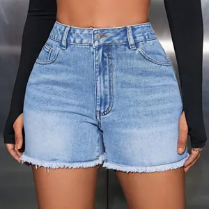 Close-up of light blue high-waisted denim shorts with a trendy raw hem finish.