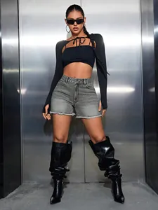 High-waist grey denim shorts with chic raw edges styled with a trendy cropped black top