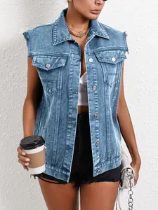 Close-up of a women's vintage blue denim vest styled with black shorts and accessories