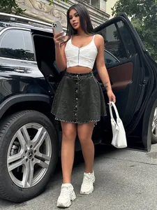 Detailed view of high-waist grey denim mini skirt with front button closure