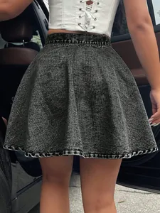 Back view showing the fabric detail of a high-waisted gray washed denim flared skirt