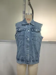 Detailed front view of a light blue denim vest with frayed armholes on a dress form