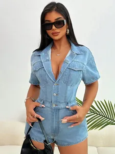 Detailed view of light blue denim romper featuring a lapel collar and flap pockets