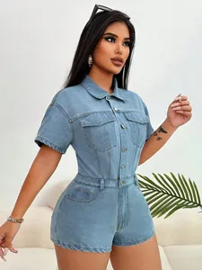Detailed view of fashionable light blue denim romper with lapel collar and chest pockets