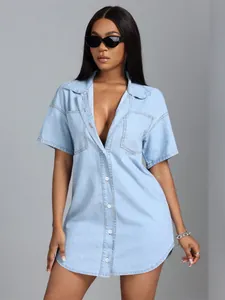 Detail shot of a women's light blue short-sleeved loose denim shirt with lapel collar