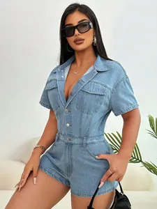Fashionable light blue denim romper with short sleeves and buttoned front pockets.