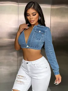 Detail of a sexy cropped denim top with one sleeve and collar, trendy streetwear style.