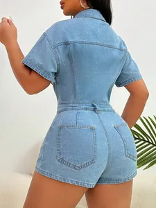 Close-up back detail of a light blue denim romper featuring stitch work and back pockets