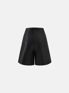 Back view of high-waisted black PU leather wide-leg A-line shorts with fine texture