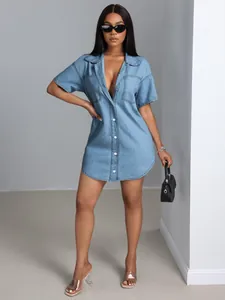 Full-body view of a stylish short-sleeve denim shirt dress with turn-down collar and pockets.