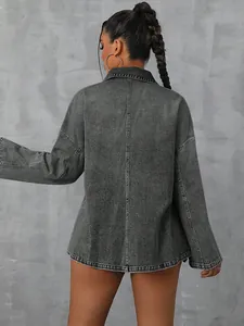 Back view of a loose grey washed denim jacket with long sleeves and seam detail.