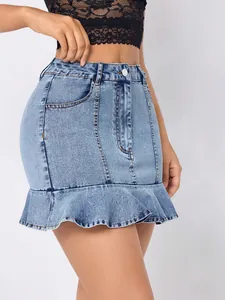 Detail shot of a light blue high waist denim mini skirt featuring a stylish ruffle hem