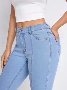 Close-up detail of blue high waisted skinny jeans with stylish seam stitching