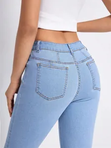 Fashionable high-waisted light blue skinny jeans for women featuring classic back pocket details