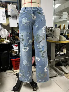 Detailed view of women's vintage floral print straight leg denim jeans on a tailor mannequin