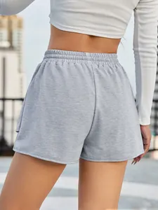 Detail back view of grey loose athletic shorts with elastic waistband for women