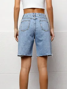 Detailed back view of women's loose casual washed denim bermuda shorts featuring raw hems