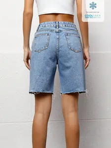 Back view detail of women's casual light wash denim bermuda shorts featuring raw hem edge