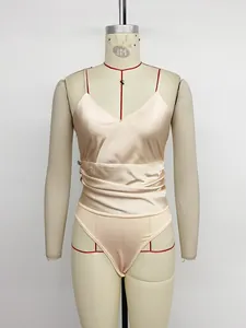 Detailed view of champagne satin bodysuit featuring elegant V-neck and pleated waistline