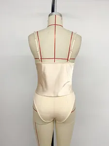 Back view detail of elegant champagne satin bodysuit featuring delicate pearl beaded shoulder straps