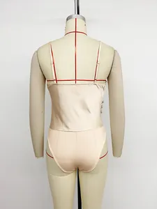 Back view of a elegant champagne satin bodysuit with adjustable straps on a dress form