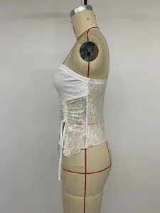Detail view of a white floral lace tube top with side ruched drawstring design.