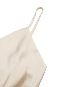 Close-up detail of champagne satin bodysuit showing fine strap and smooth fabric texture