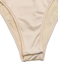 Close-up detail of the bottom gusset and precise stitching on a beige satin bodysuit