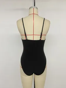 Back view of black backless bodysuit with adjustable spaghetti straps on mannequin