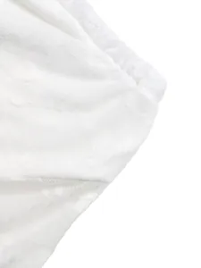 Detailed close-up showing the intricate texture of white floral lace and mesh fabric