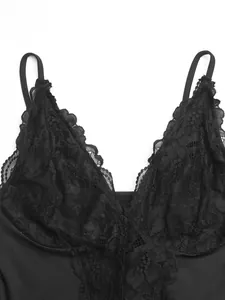 Close-up of black lace V-neck camisole bodysuit with intricate floral patterns.