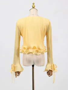 Elegant yellow pleated short blouse with ruffle hem and flared tie-cuffs for women
