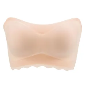 Seamless skin-colored strapless bandeau bra with scalloped edges for invisible support.