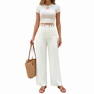 Eleganti pantaloni bianchi a gamba larga con dettaglio in pizzo traforato in vita