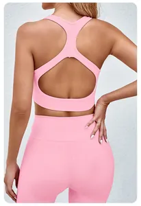 Pink seamless yoga set with cutout sports bra and high waisted leggings back view detail
