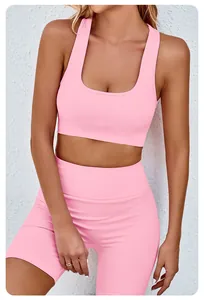 Detail view of pink seamless yoga set with sports bra and high-waisted fitness shorts