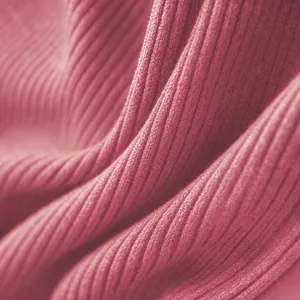 High-quality soft and breathable pink ribbed fabric texture for seamless athletic yoga jumpsuits