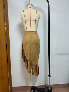 Back view detail of high waist vintage brown suede midi skirt with long asymmetrical fringe hem