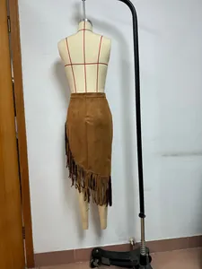 Western style brown suede fringe skirt with asymmetrical hem displayed on a mannequin