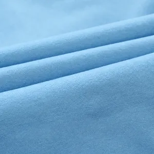 Close-up detail of blue cationic fabric for seamless yoga set showing texture and composition.
